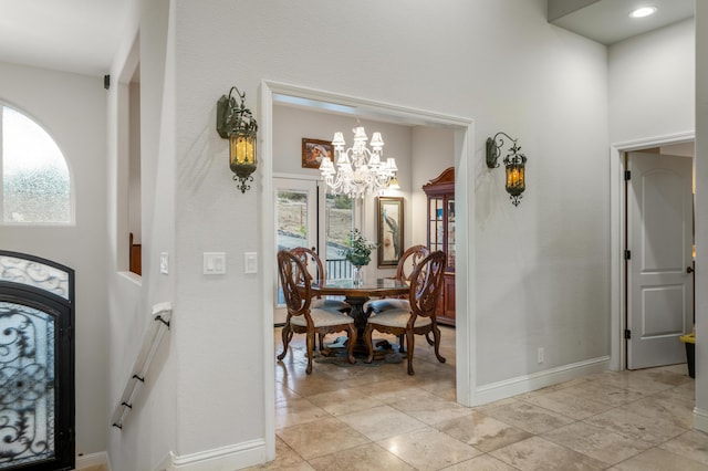 entrance foyer featuring an inviting chandelier