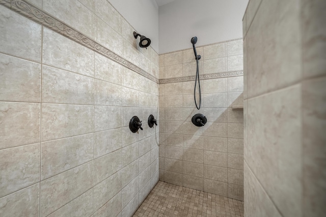 bathroom with a tile shower