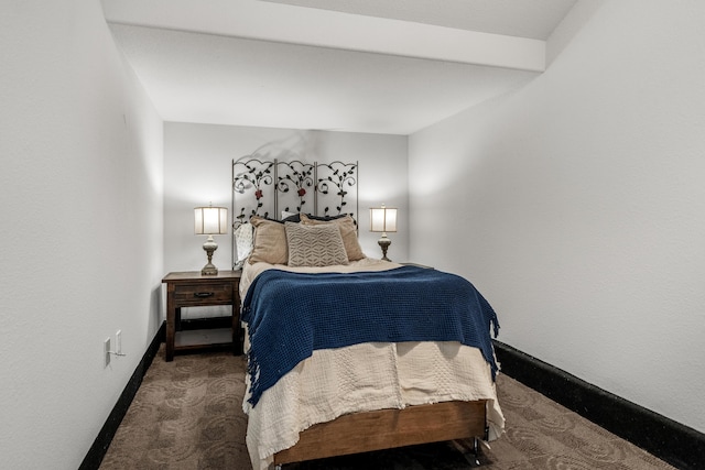 bedroom featuring dark colored carpet