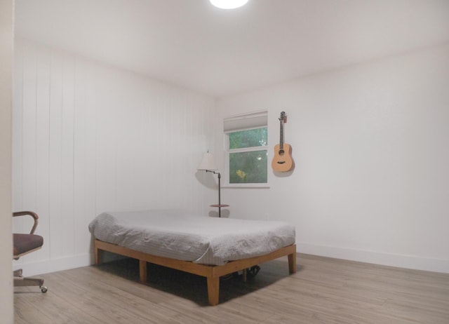 bedroom with light wood-type flooring