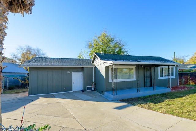 ranch-style home with a front yard and covered porch