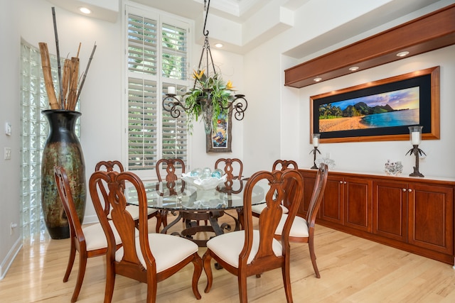 dining space with light hardwood / wood-style floors and plenty of natural light