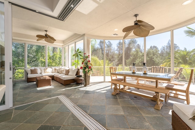 sunroom / solarium with ceiling fan