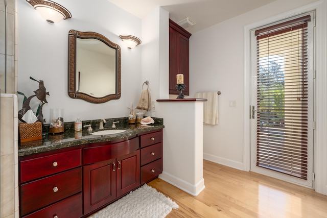 bathroom featuring vanity and hardwood / wood-style floors