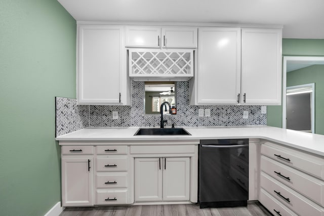 2648 Tremonto Rd, Anderson, CA 96007 - kitchen featuring decorative backsplash, white cabinets, light countertops, and a sink