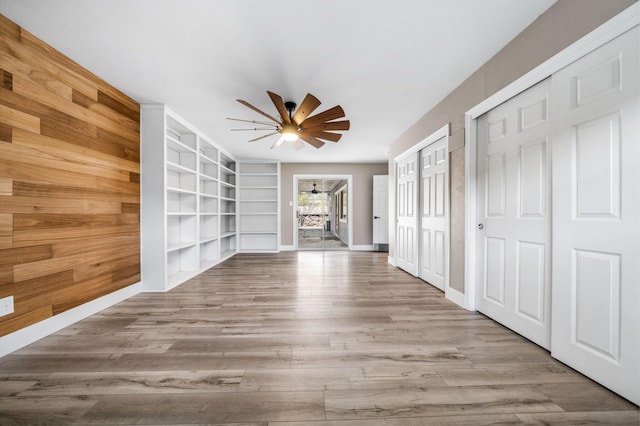2648 Tremonto Rd, Anderson, CA 96007 - interior space with built in shelves, wood finished floors, baseboards, and ceiling fan