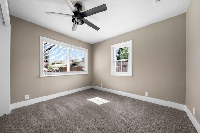 2648 Tremonto Rd, Anderson, CA 96007 - spare room featuring a ceiling fan, baseboards, a wealth of natural light, and carpet floors