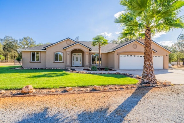 ranch-style house featuring a front lawn and a garage