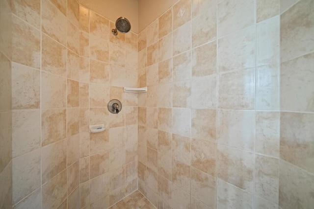 bathroom with a tile shower