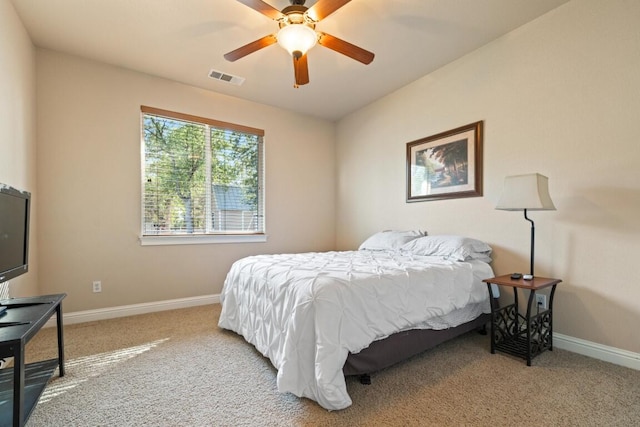 bedroom featuring ceiling fan and carpet