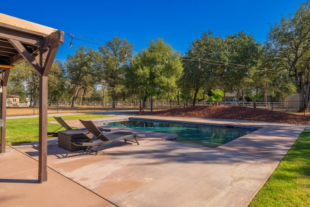 view of swimming pool with a lawn and a patio