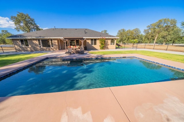 view of pool featuring a yard and a patio area