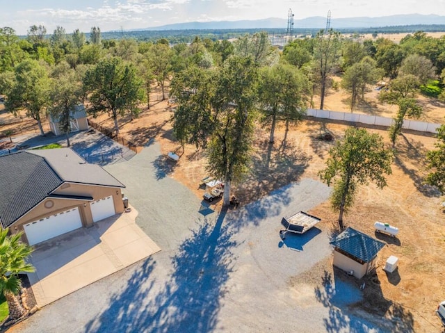 birds eye view of property featuring a mountain view