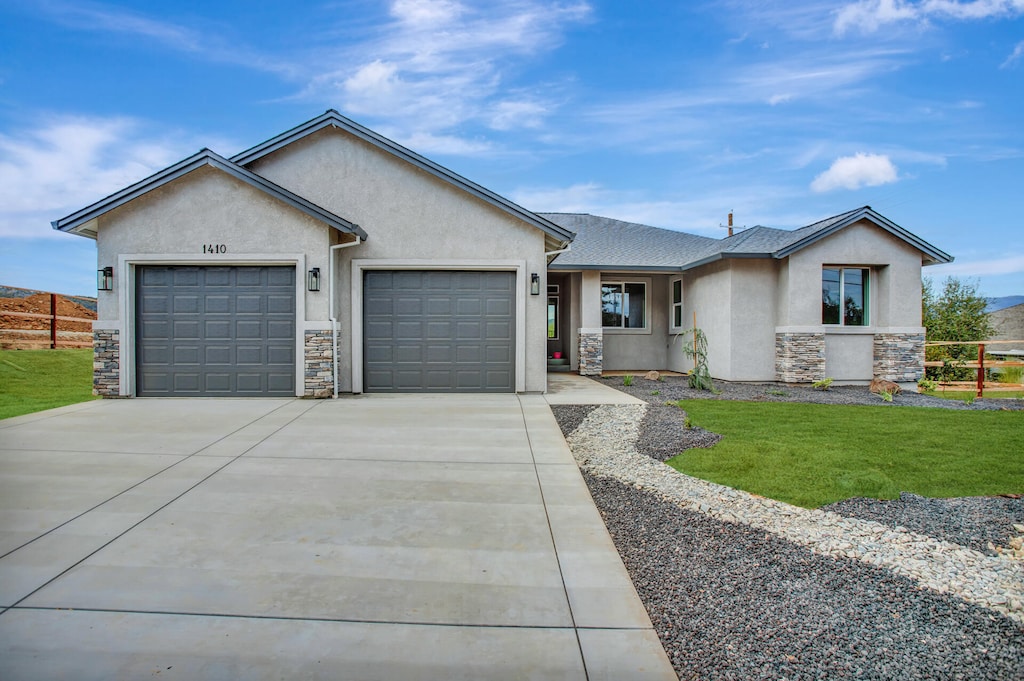 single story home featuring a garage