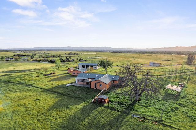 drone / aerial view with a mountain view and a rural view