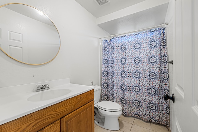 bathroom featuring a shower with curtain, vanity, toilet, and tile patterned floors