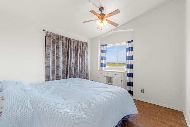 bedroom featuring lofted ceiling, hardwood / wood-style flooring, and ceiling fan