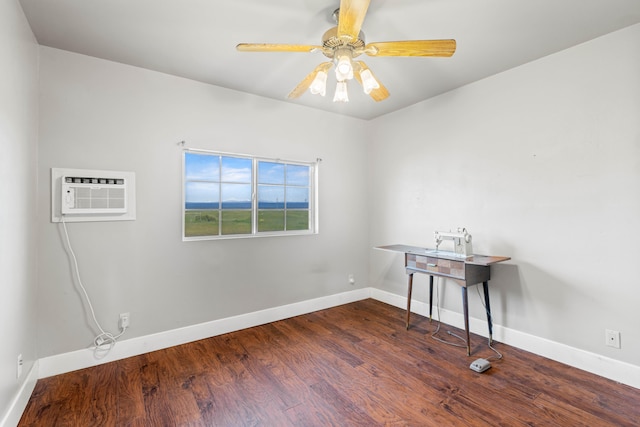 unfurnished room featuring ceiling fan, dark hardwood / wood-style flooring, and a wall unit AC