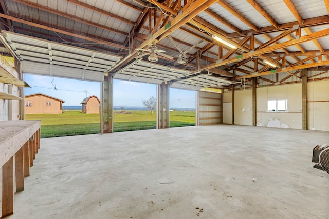 garage featuring a lawn