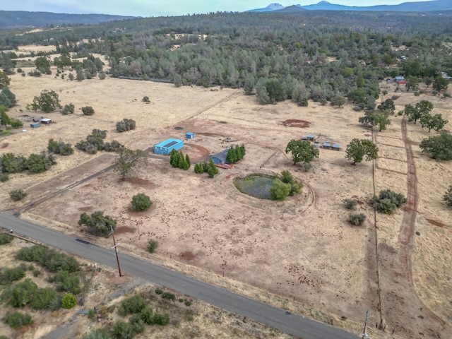 birds eye view of property featuring a mountain view and a rural view