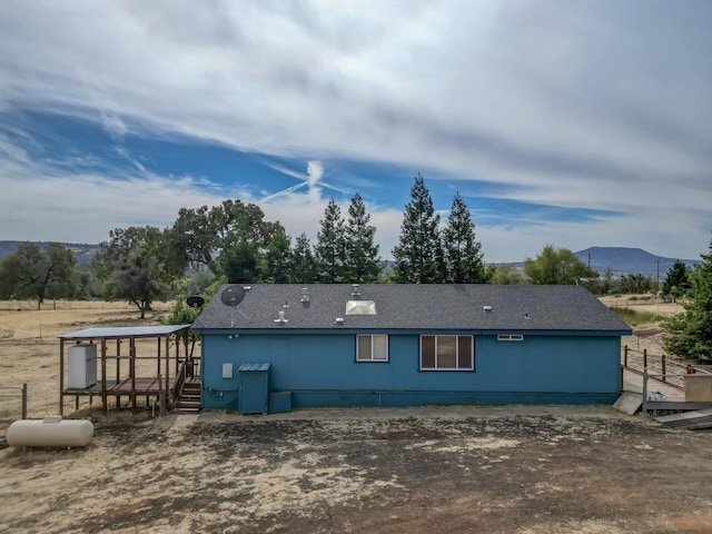 rear view of house with a mountain view