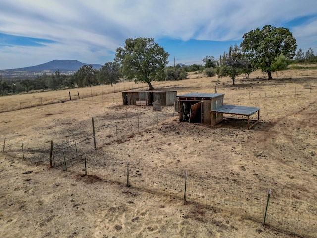 exterior space featuring a rural view and a mountain view