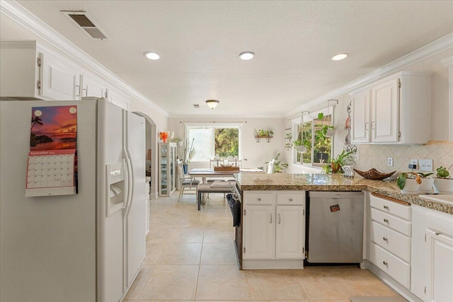 kitchen with white fridge with ice dispenser, white cabinetry, and dishwasher