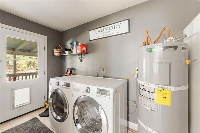 laundry area featuring separate washer and dryer, water heater, and light tile patterned flooring