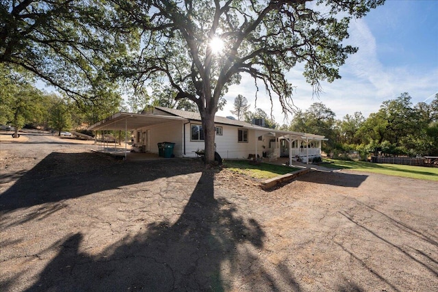 exterior space with a carport