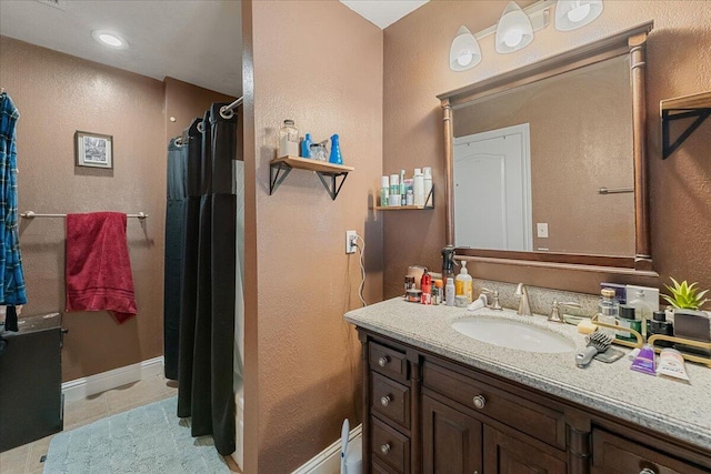 bathroom with vanity, shower / tub combo, and tile patterned floors