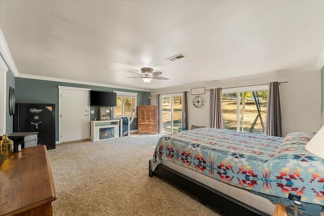 bedroom with access to outside, carpet flooring, ornamental molding, and ceiling fan