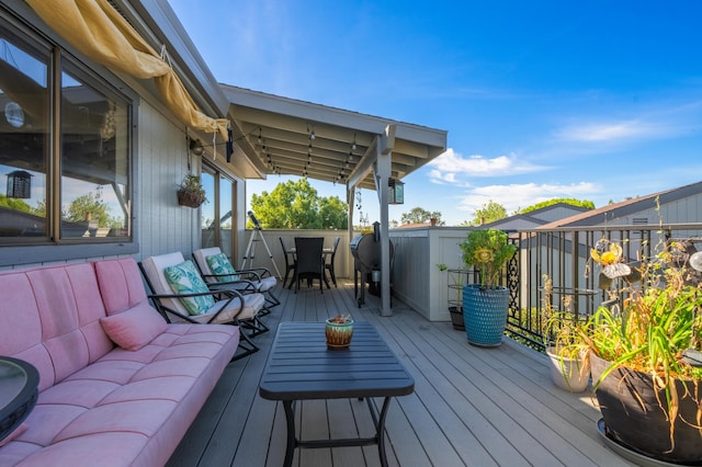 wooden terrace with outdoor lounge area