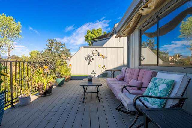 deck with an outdoor hangout area