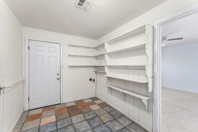 spacious closet with ceiling fan