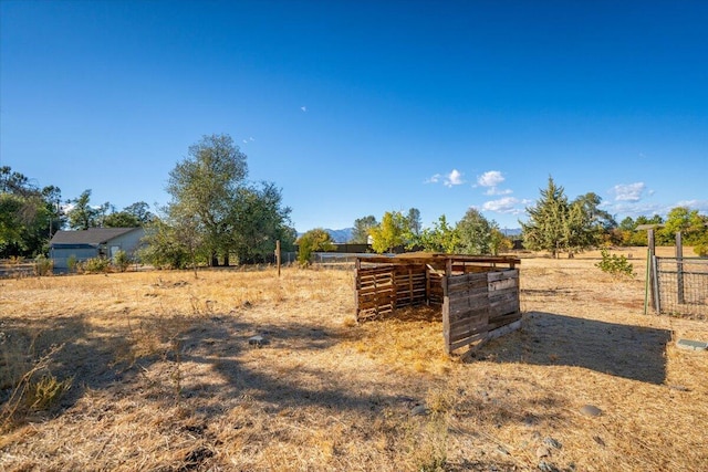 view of yard with a rural view