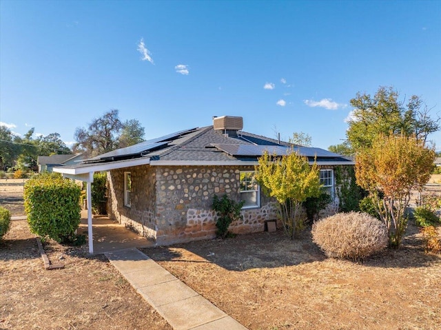 view of front of home featuring solar panels