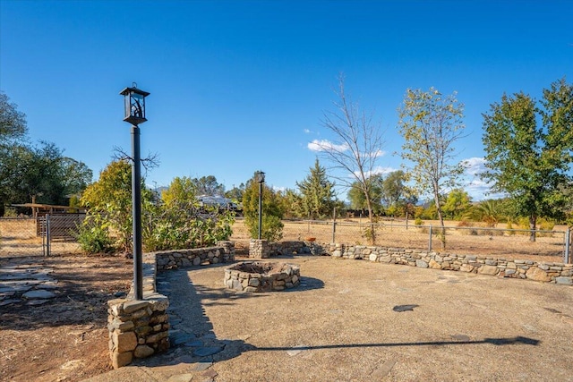 view of yard with a fire pit