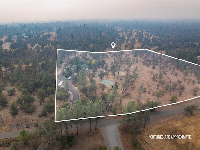 birds eye view of property with a rural view