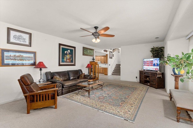 living room with carpet floors and ceiling fan