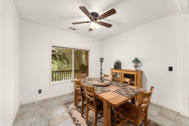 dining room featuring ceiling fan