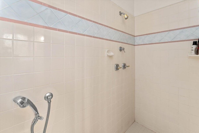 bathroom with tiled shower