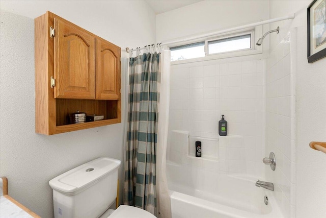 bathroom with shower / bathtub combination with curtain and toilet