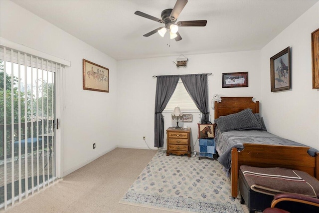 carpeted bedroom with ceiling fan and access to exterior