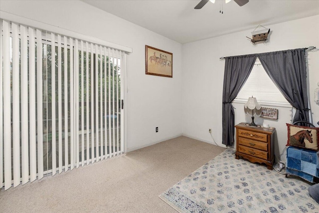 sitting room with light carpet and ceiling fan