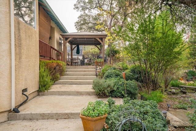 exterior space featuring a gazebo and a wooden deck