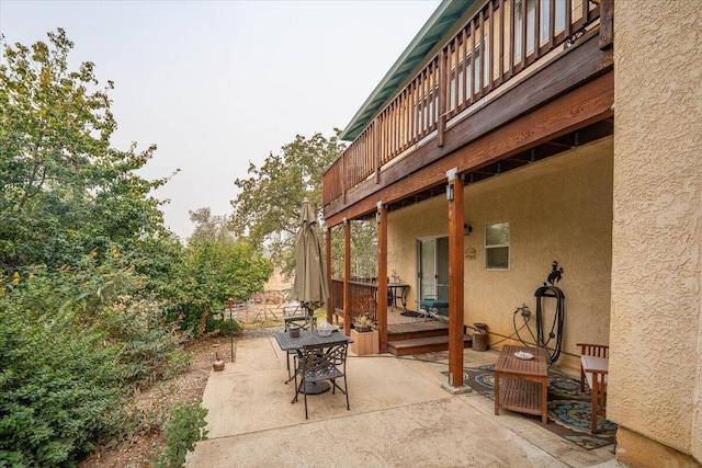 view of patio with a wooden deck