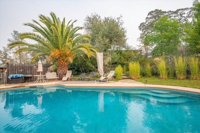 view of pool featuring a patio area