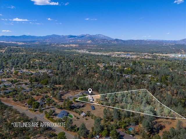 birds eye view of property featuring a mountain view