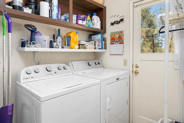 washroom featuring washer and clothes dryer