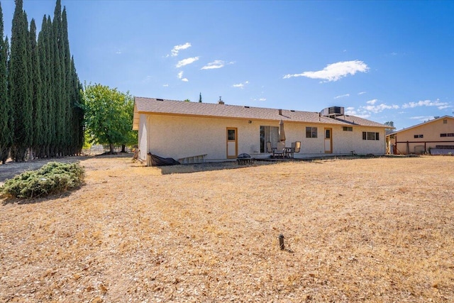 back of property with a patio area